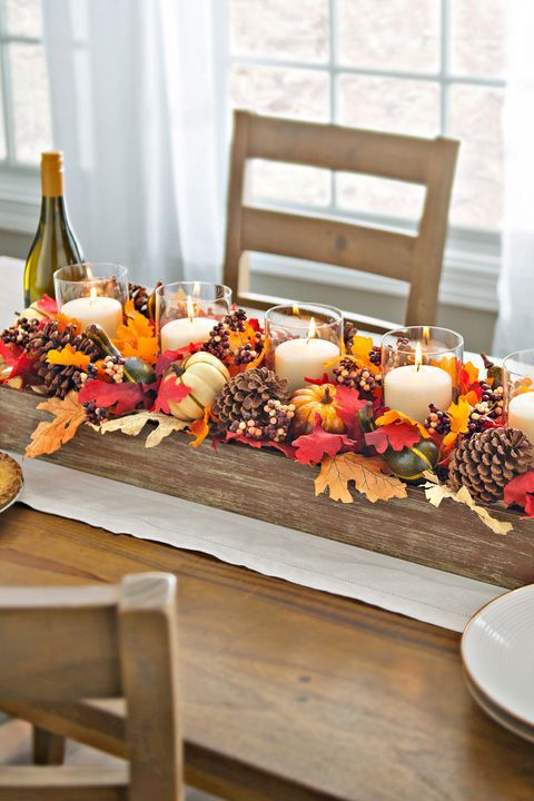 Candles And Pinecones DIY Centerpiece Via Country Living