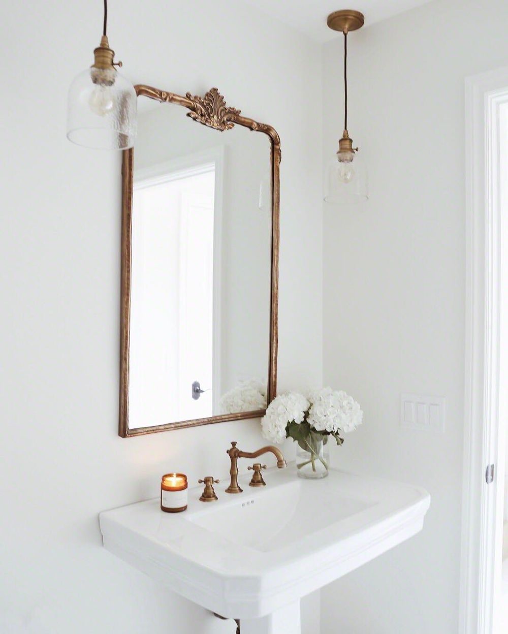 Parisian bathroom with Brass Lighting Fixtures and Brass Faucet via @lindsaymarcella