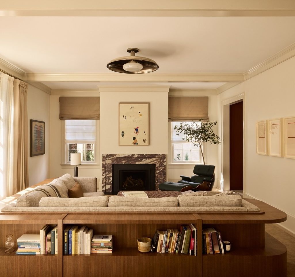 Living room storage behind sofa shelving zoefeldmandesign